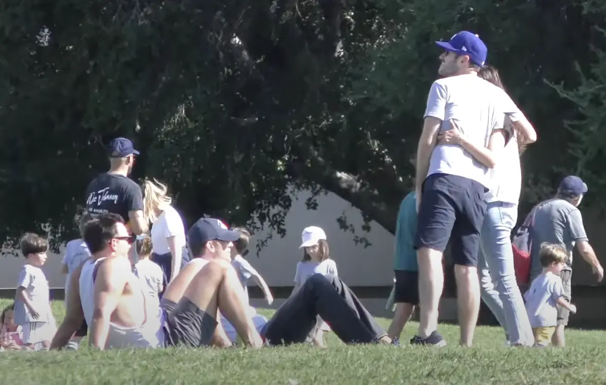 Mila Kunis standing with a group of unidentified people, posted in 2023. | Source: YouTube/@TheHollywoodFix