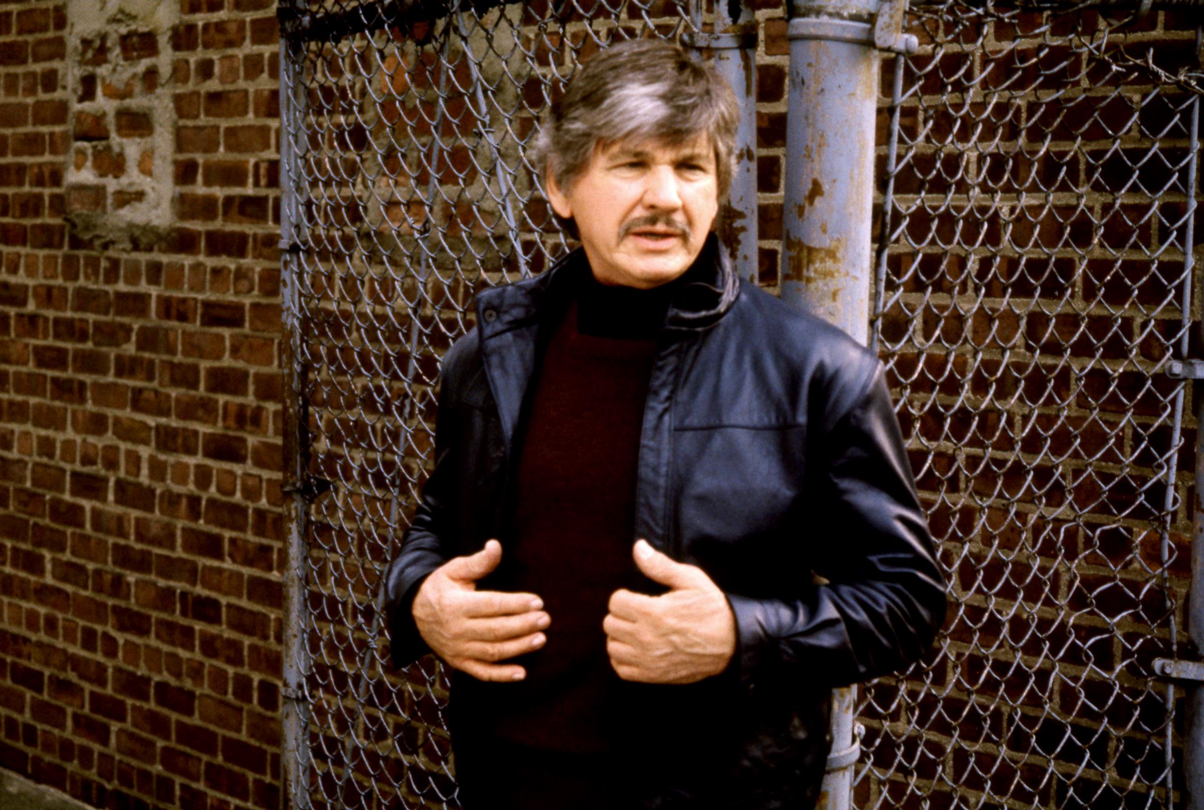 Charles Bronson portrays vigilante Paul Kersey on the set of "Death Wish 3" circa 1985, a decade after the original "Death Wish" became his breakthrough hit. | Source: Getty Images
