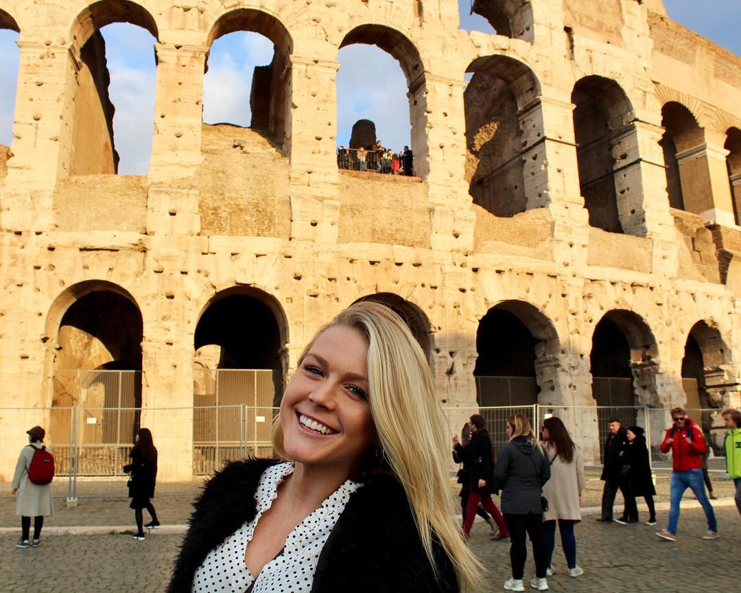 Karoline Leavitt smiles in front of the Colosseum in Rome in a photo shared in January 2018 | Source: Instagram/karolineleavitt