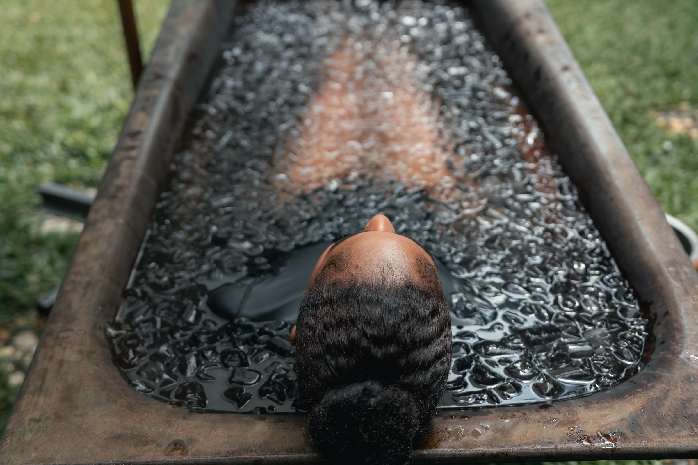 A woman submerged in ice water | Source: Getty Images