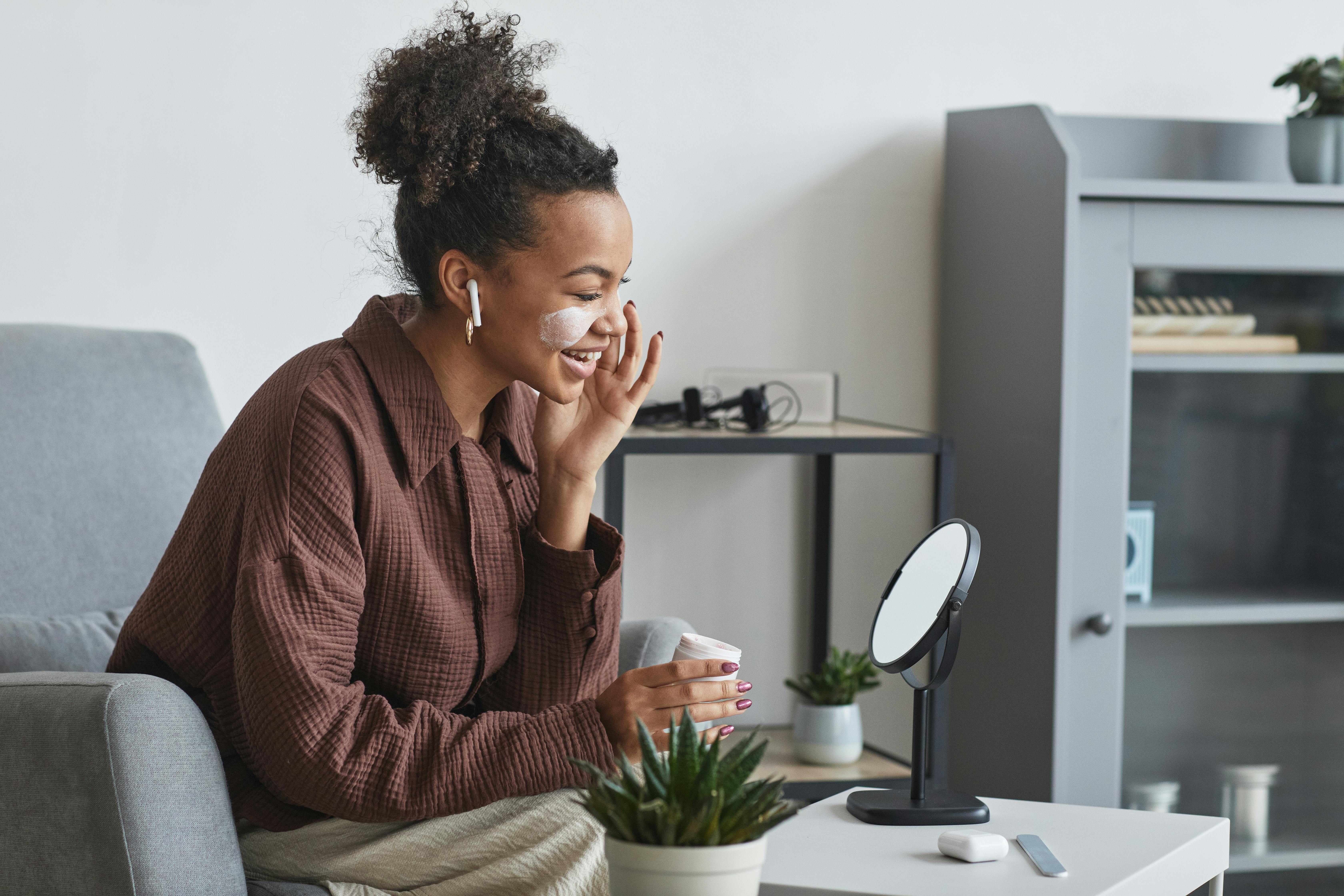 Woman with face cream on her face | Source: Pexels