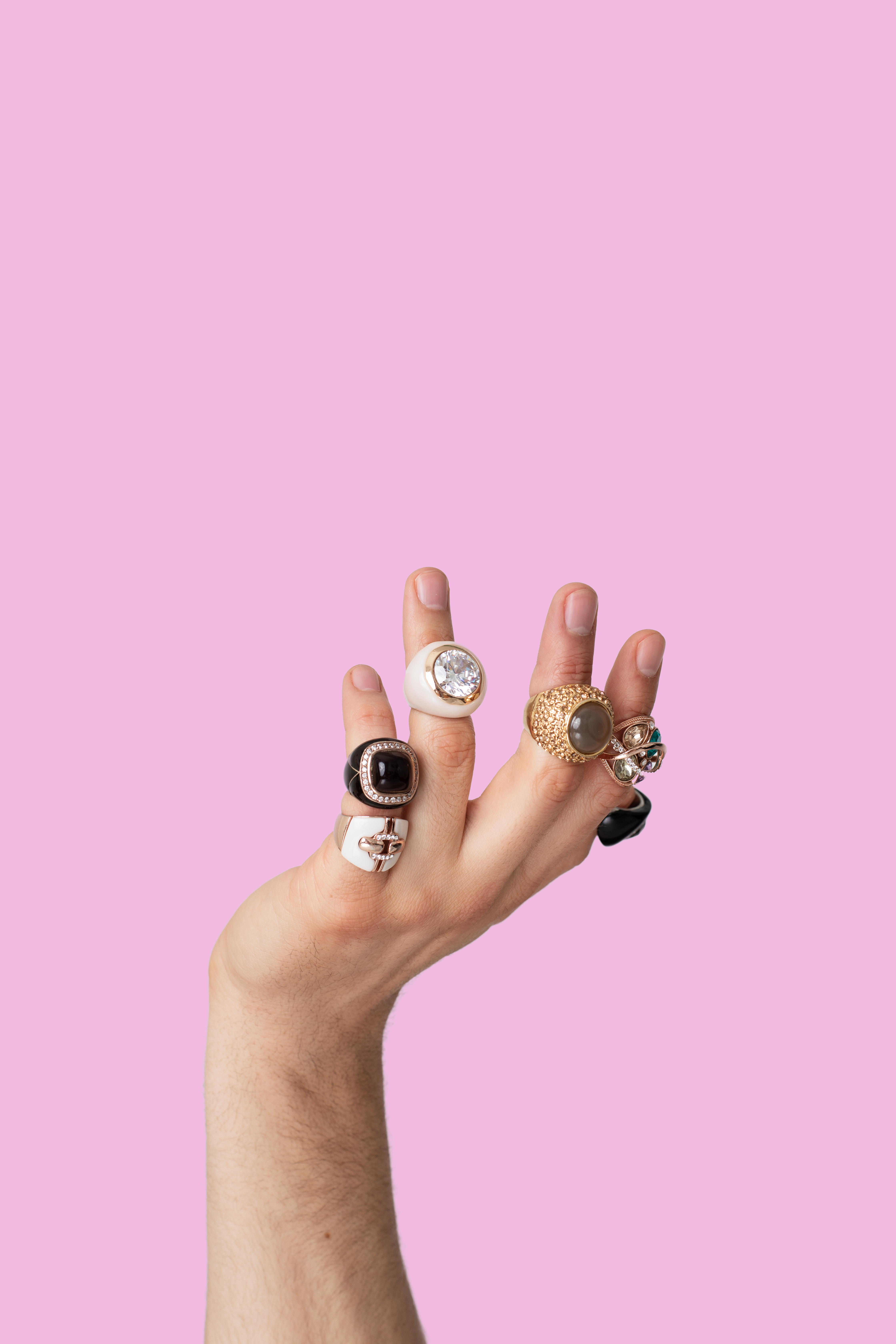 A hand stacked with jewelry rings. | Source: Getty Images