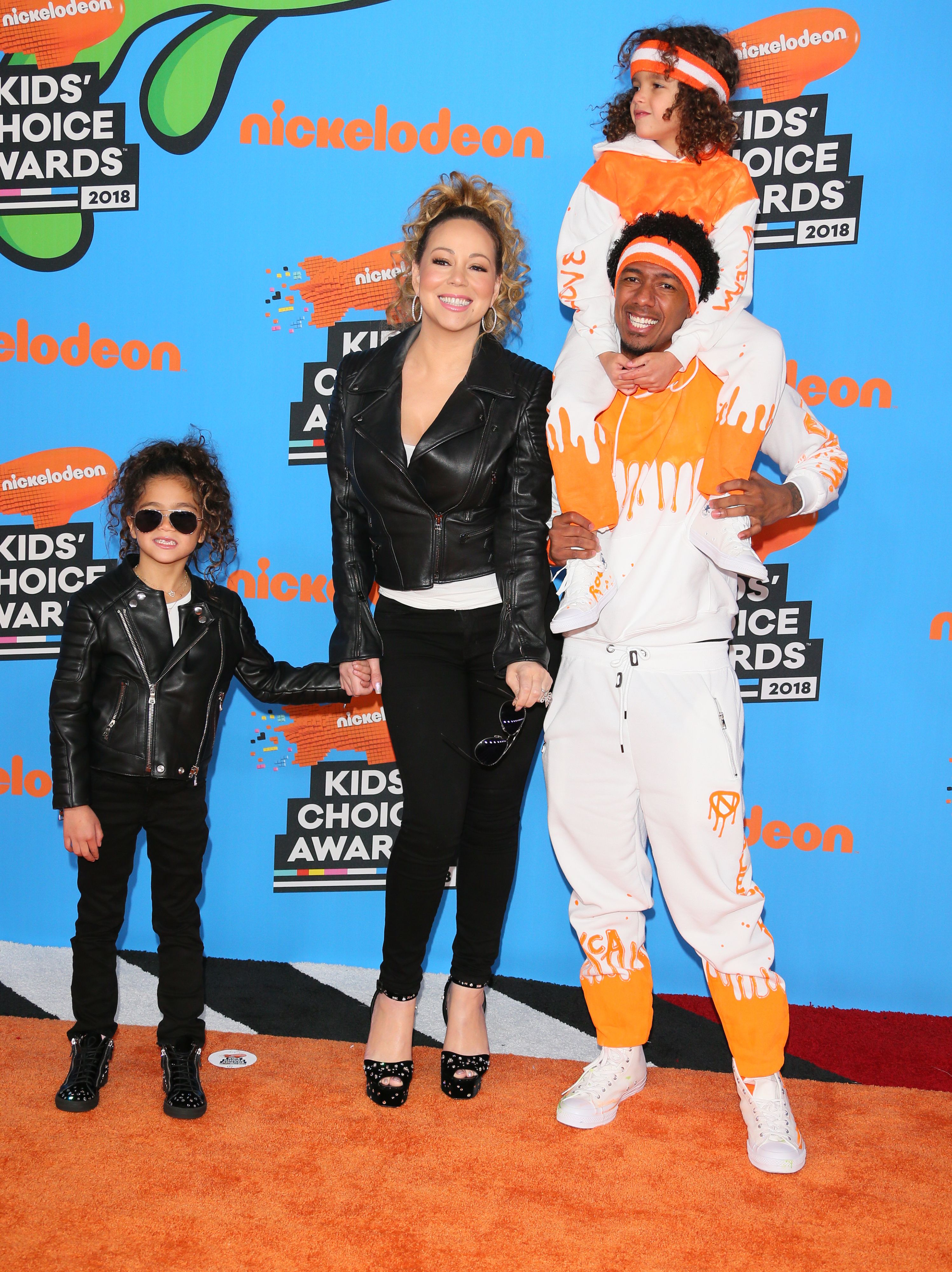 Mariah Carey and Nick Cannon arrive with their children, Monroe Cannon and Moroccan Scott Cannon, at the 31st Annual Nickelodeon Kids' Choice Awards at the Forum on March 24, 2018, in Inglewood, California.