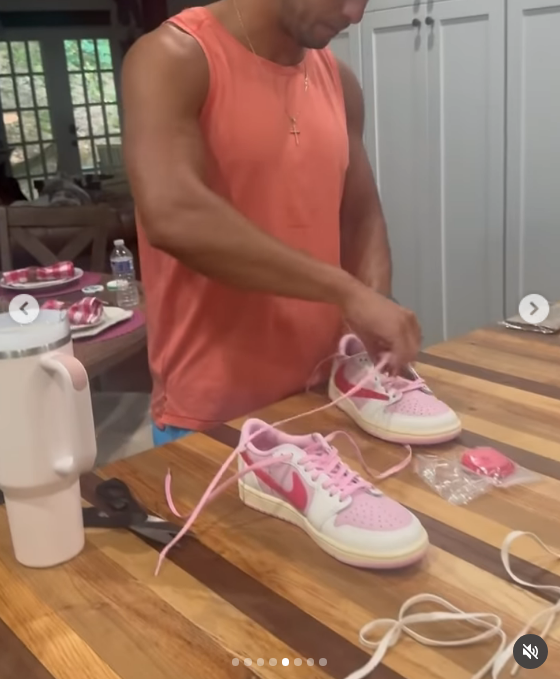 In an adorable candid moment from the birthday carousel, Brendan leans over the counter in an orange tank top to carefully lace up a pair of pink-and-white sneakers for Miranda. The helpful gesture proved to be a massive hit with fans, who gushed over his attentive husband qualities and commended Lambert for finding a partner so eager to support her in the sweet, everyday details. | Source: Instagram/mirandalambert
