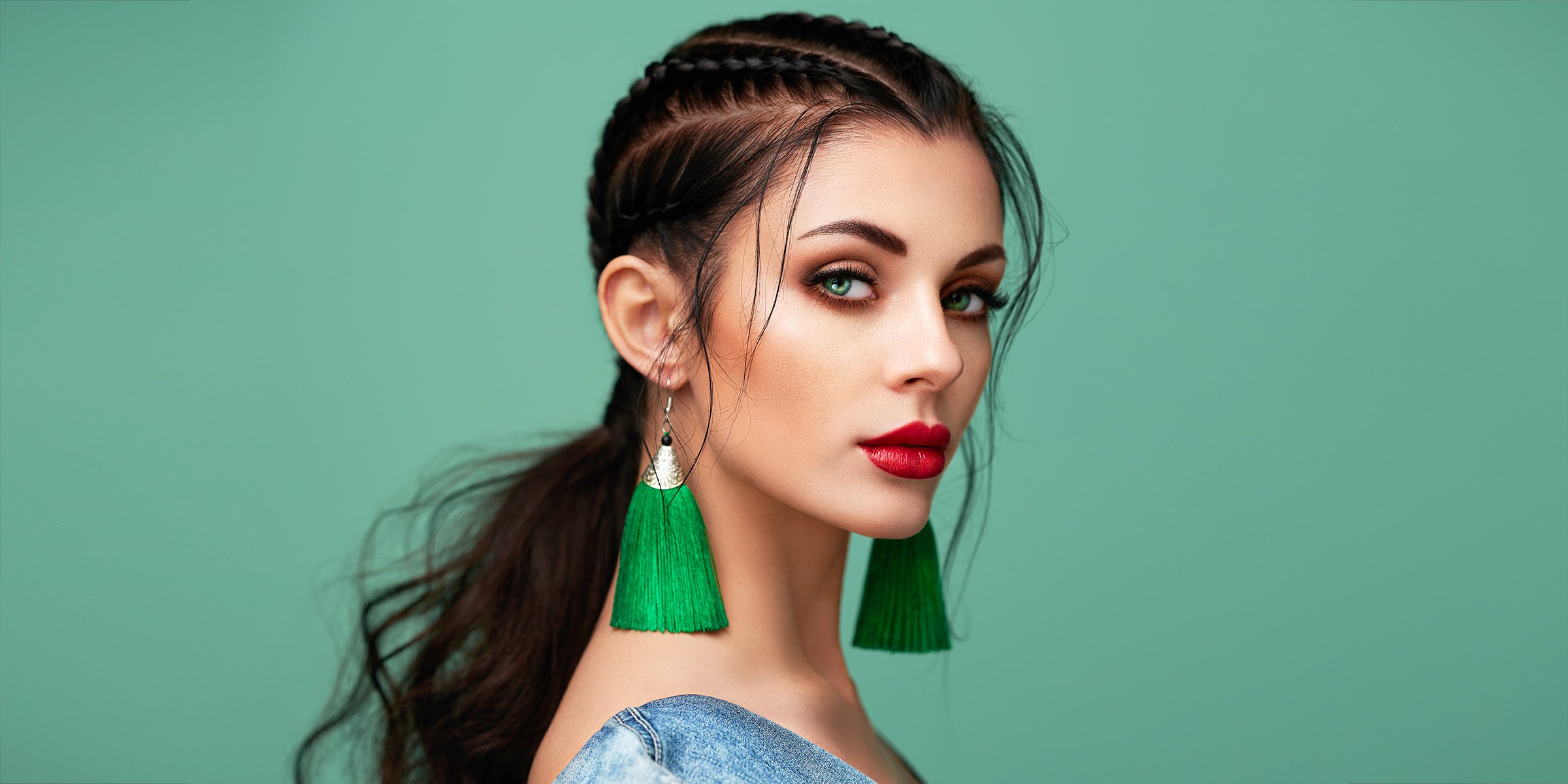 A Woman with Striking Green Eyes and Make-up Posing for a Photo | Source: Shutterstock