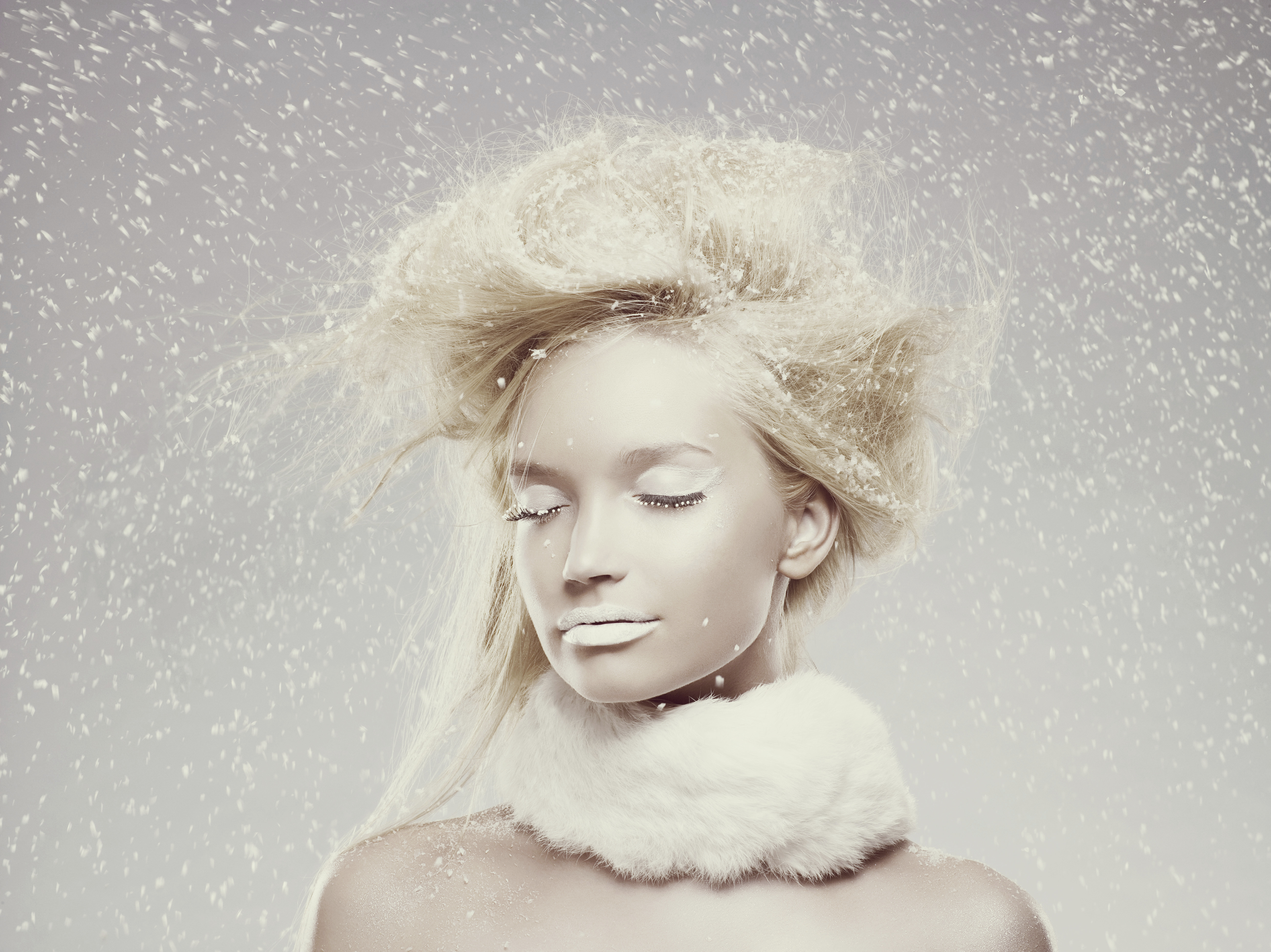 A model poses in all-white makeup. | Source: Getty Images