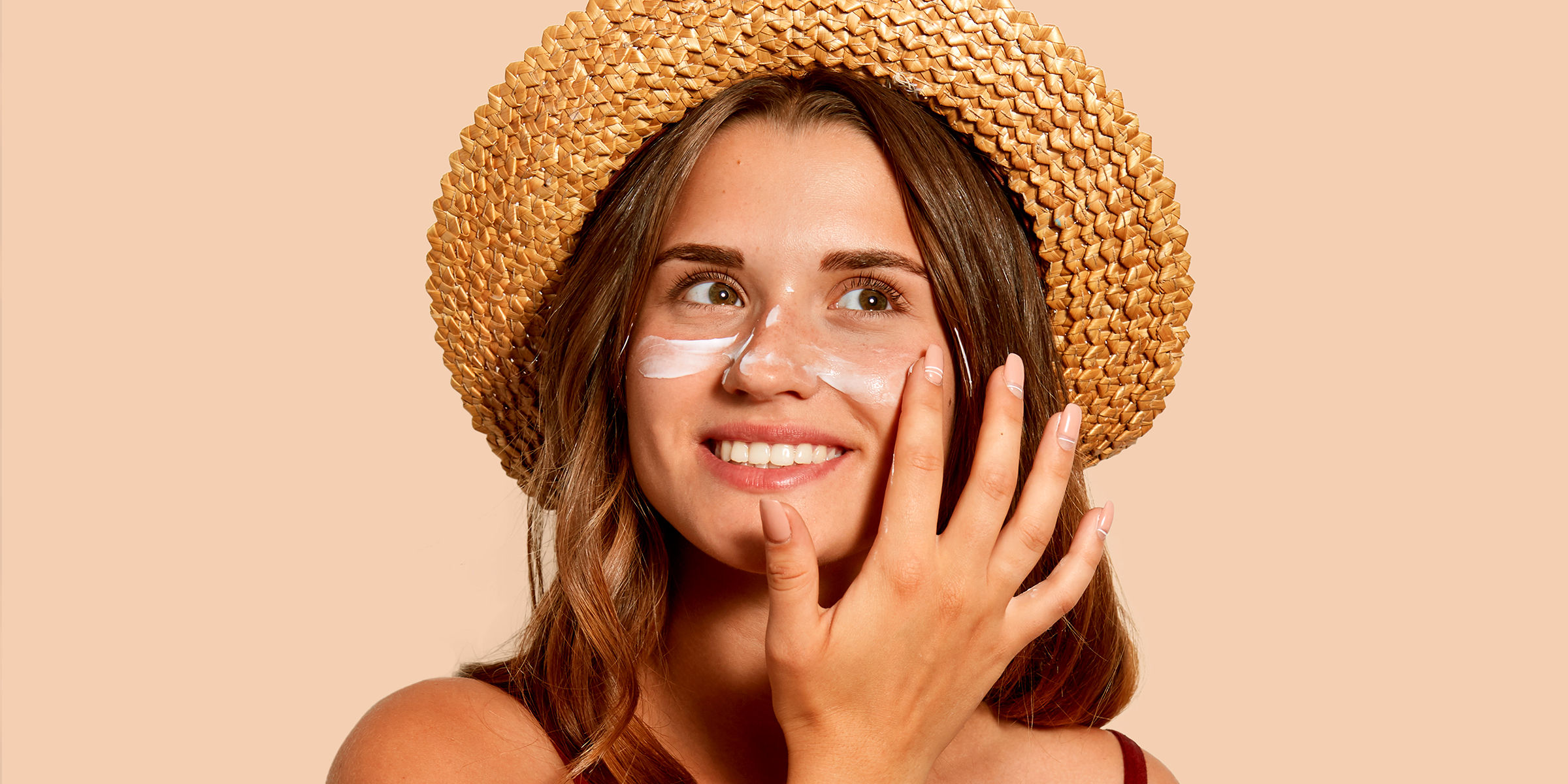 Woman Applying Sunscreen on Her Face | Source: Shutterstock