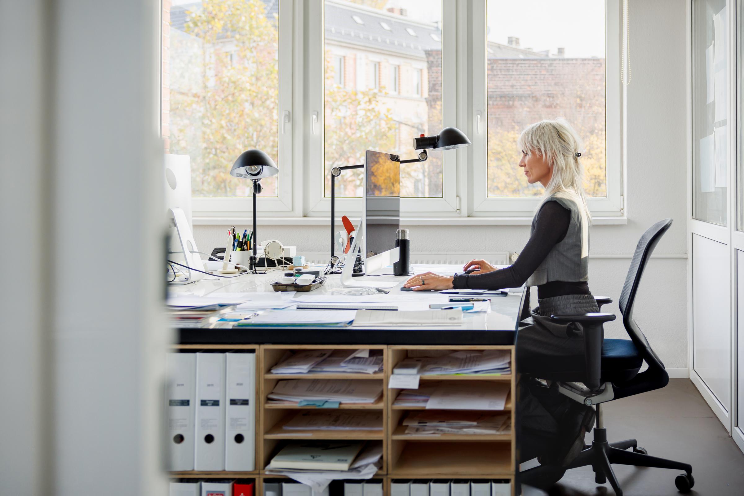 A woman working at her desk | Source: Getty Images