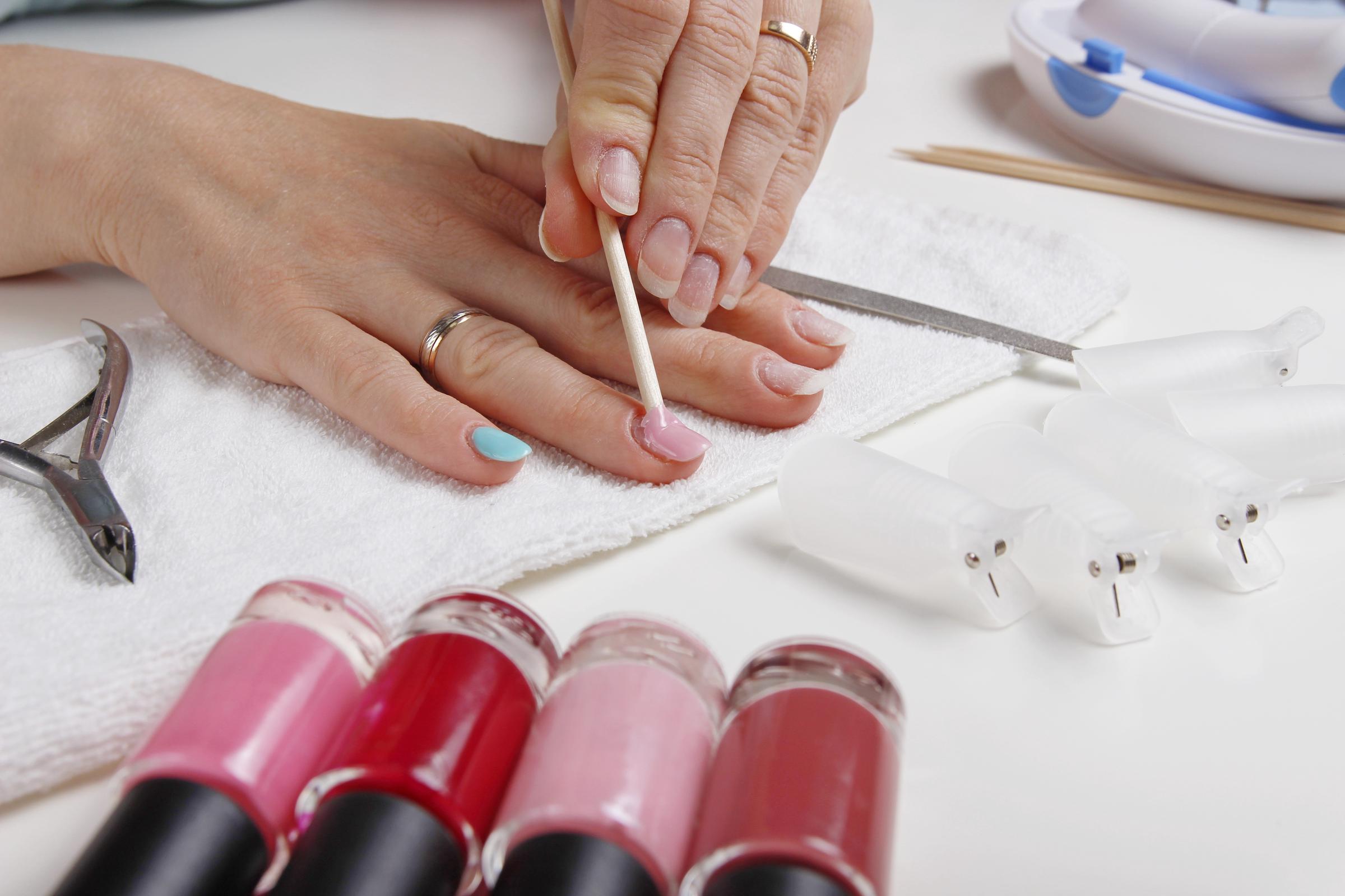 A person doing their own manicure | Source: Shutterstock