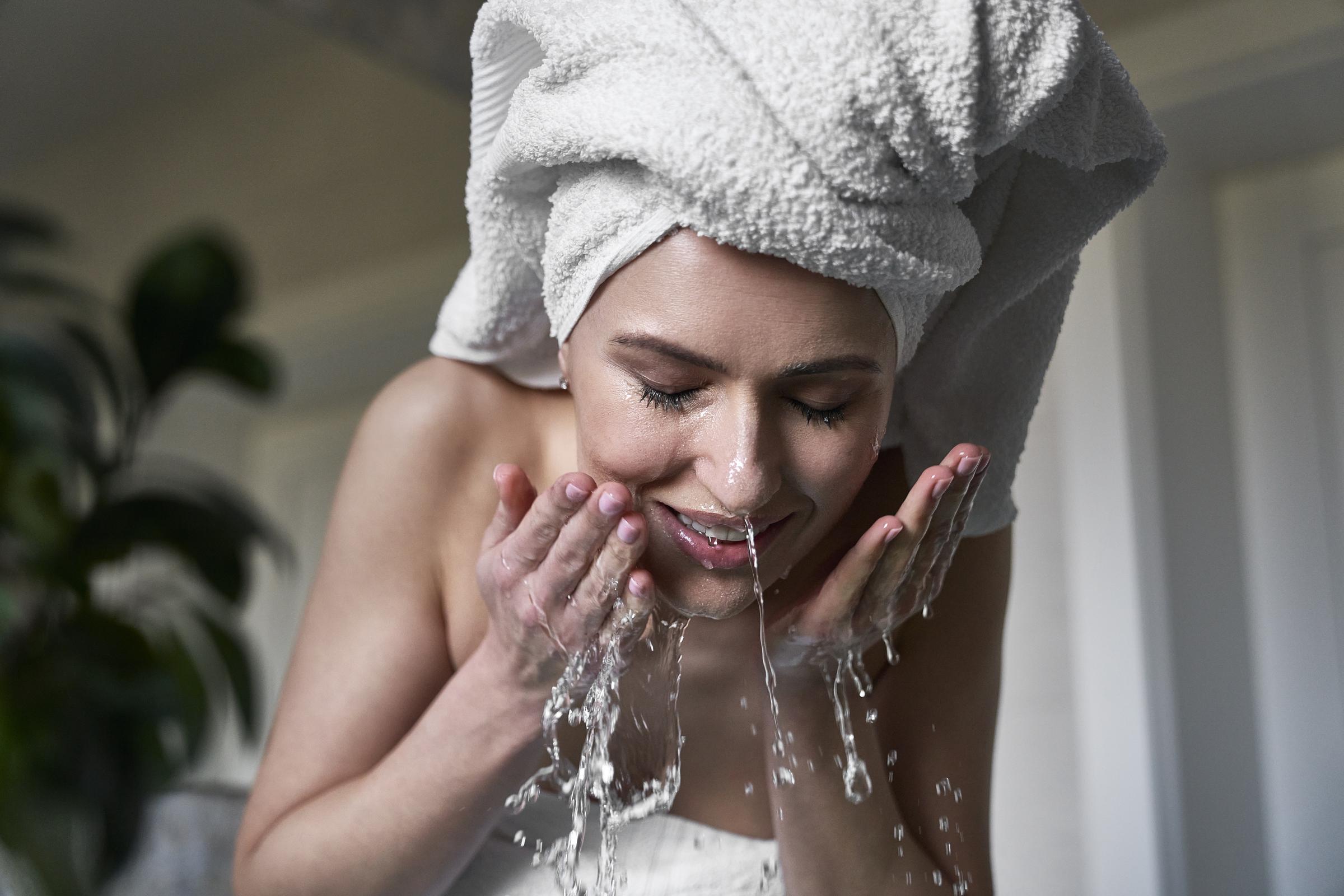 A woman washing her face | Source: Getty Images