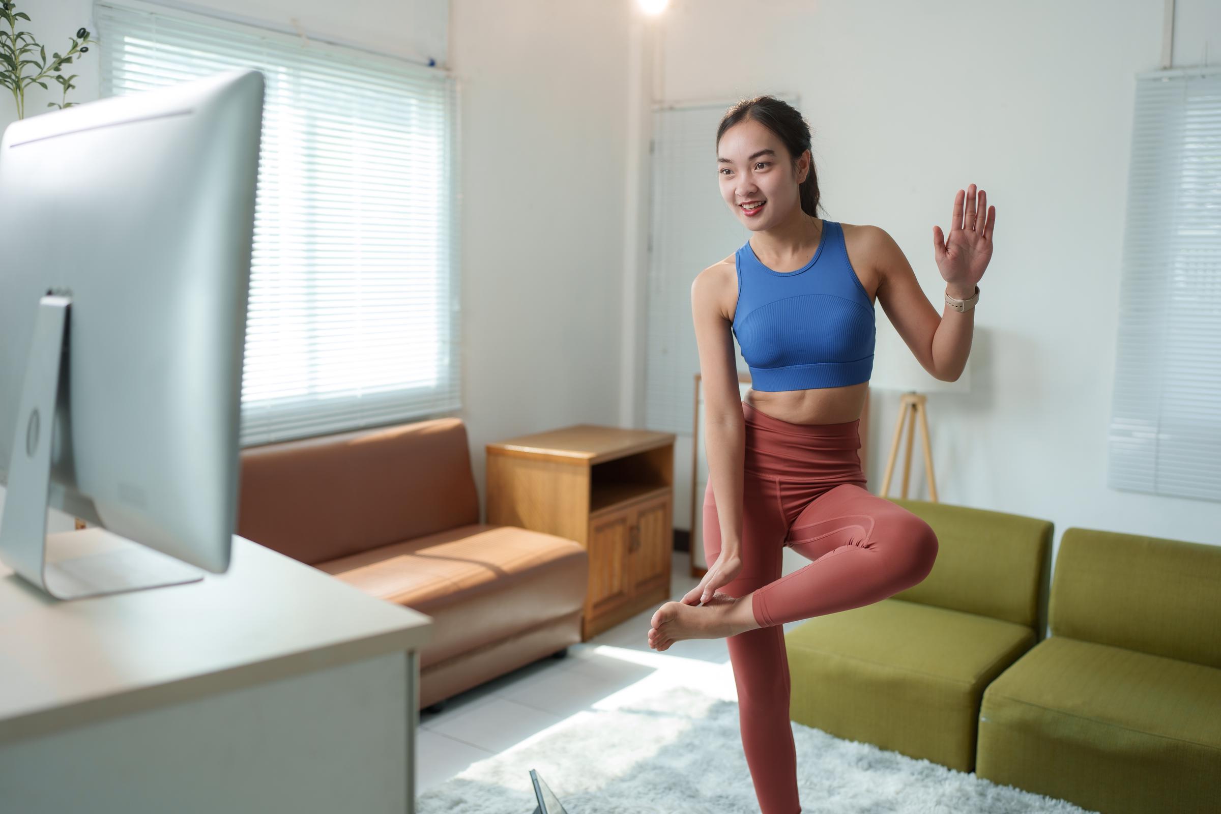 Woman doing a yoga session at home | Source: Shutterstock