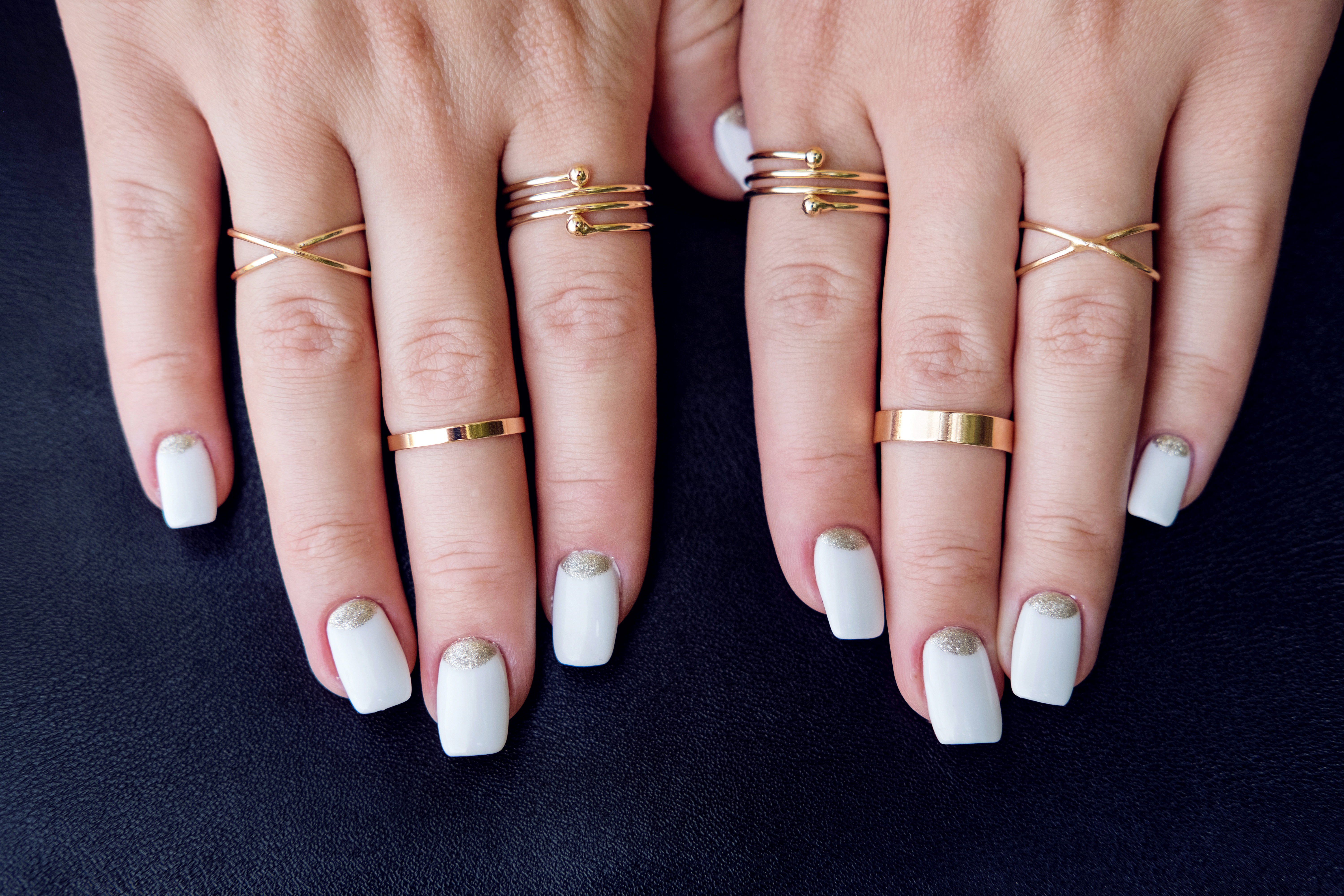 A pair of hands with fashion gold rings. | Source: Getty Images