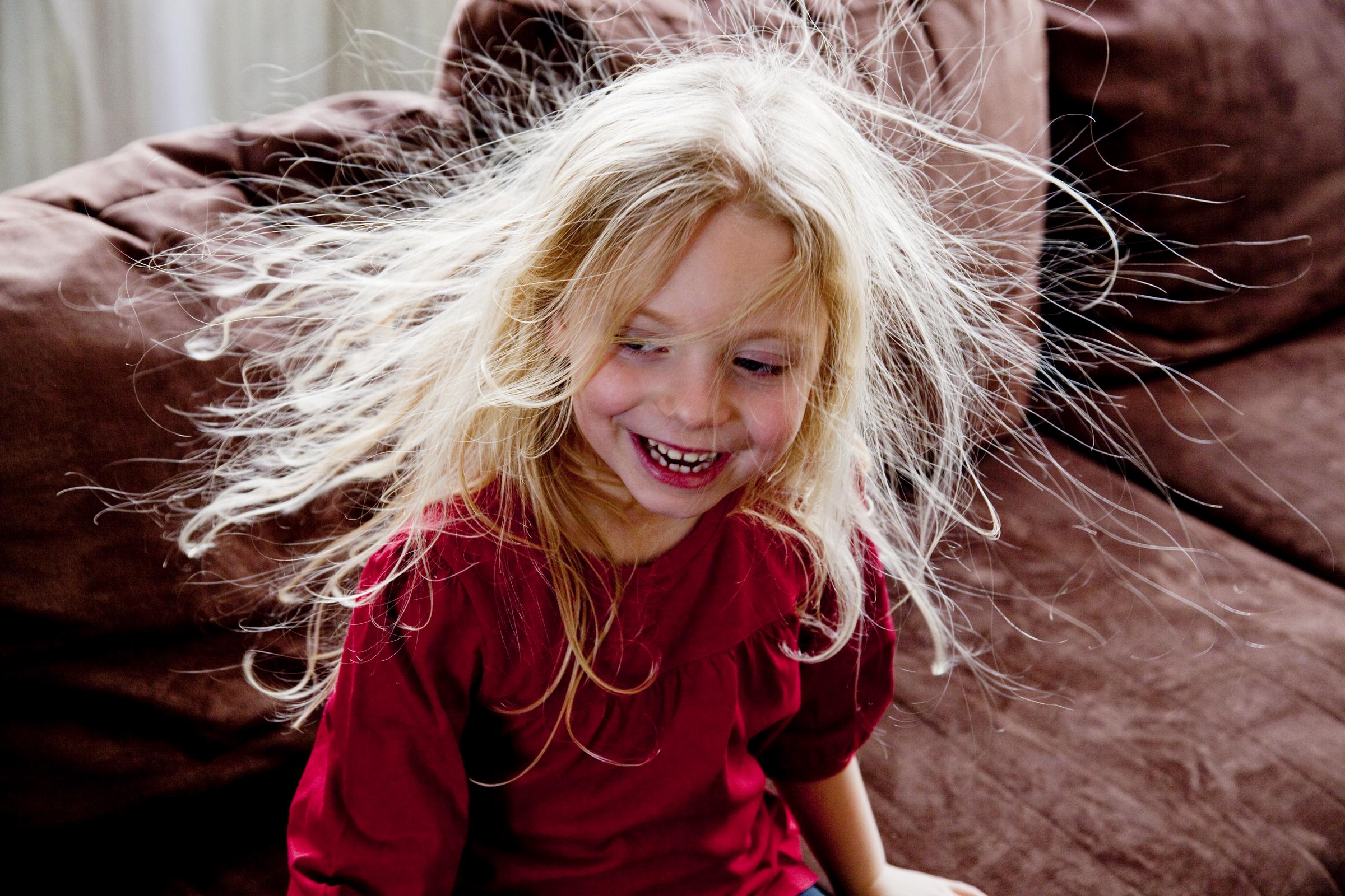 A young girl with staticy blond hair | Source: Getty Images