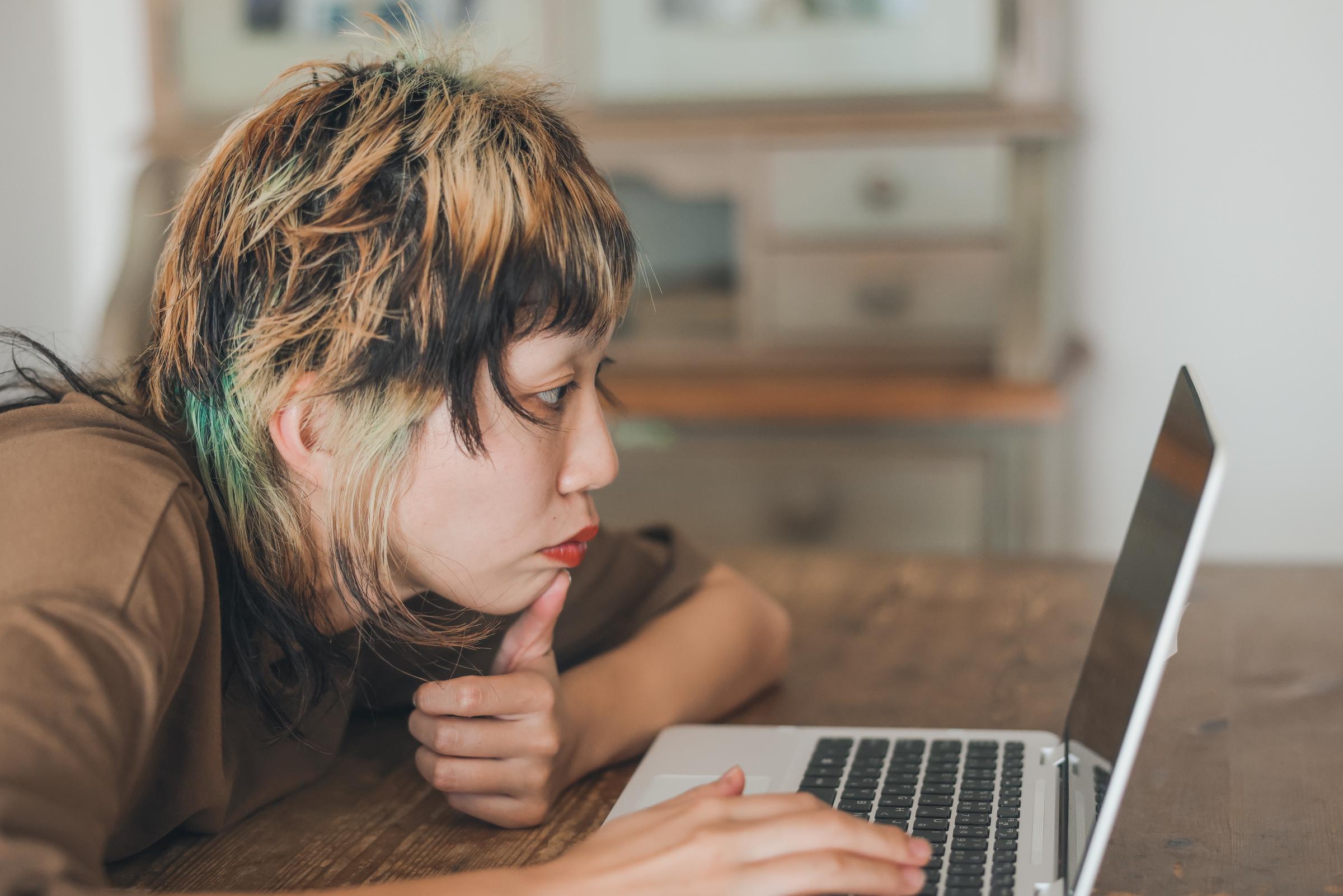 A woman using her laptop at home | Source: Getty Images