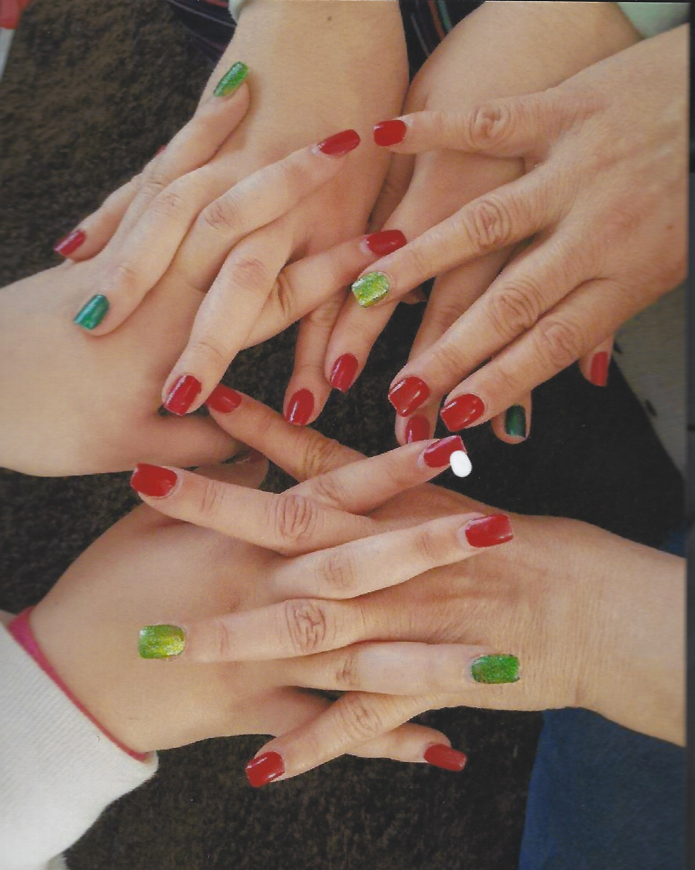 An image of hands adorned with various shades of nail polish. | Source: Pexels