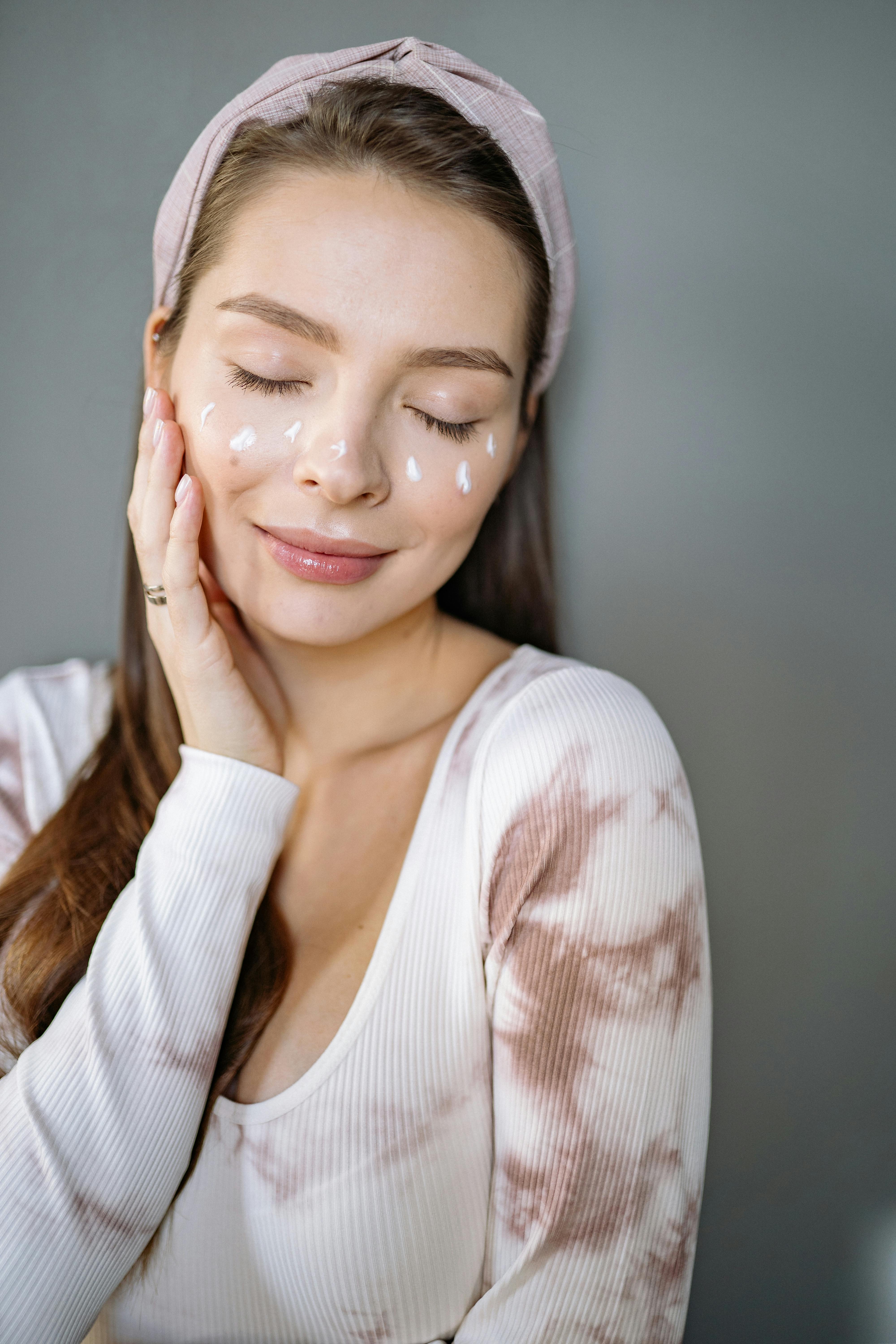 A woman with face cream on her face | Source: Pexels