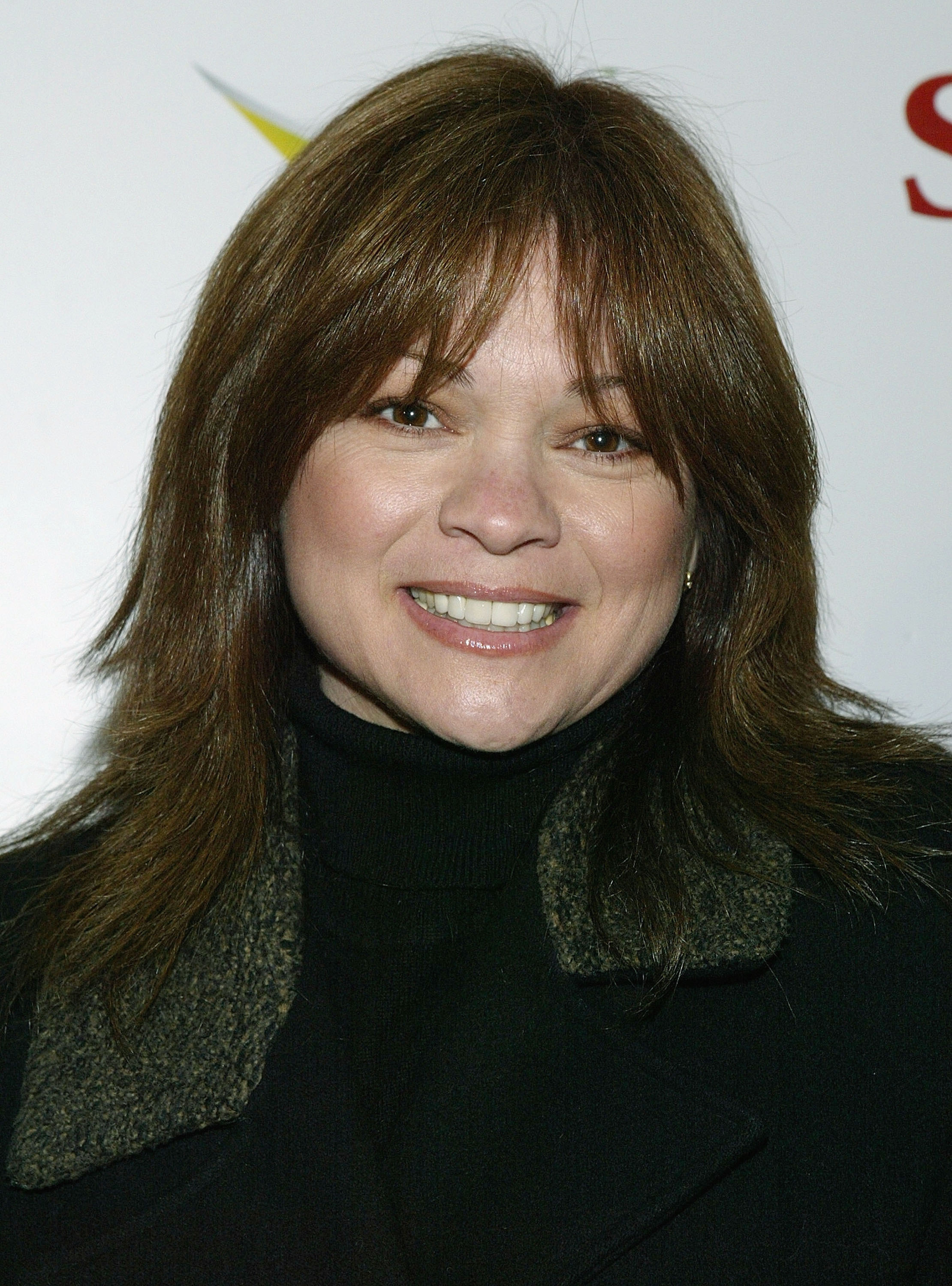 Valerie Bertinelli arrives at the MGM Studios afterparty for the film "Saved," following its Sundance Film Festival premiere in Park City, Utah. Her sleek brunette hair is straightened and falls gracefully over her shoulders, giving her a polished look.