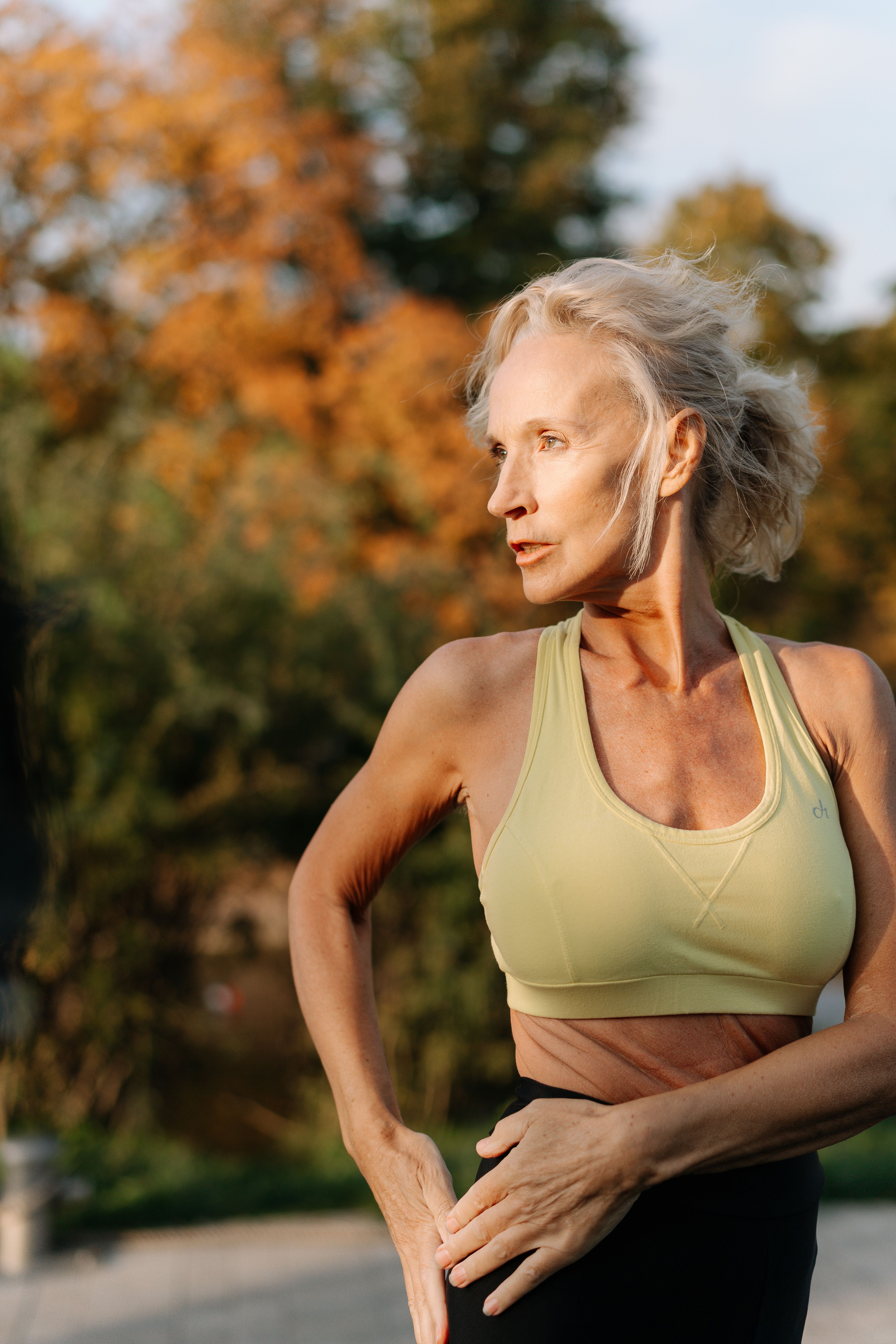 A middle-aged woman exercising outdoors | Source: Pexels