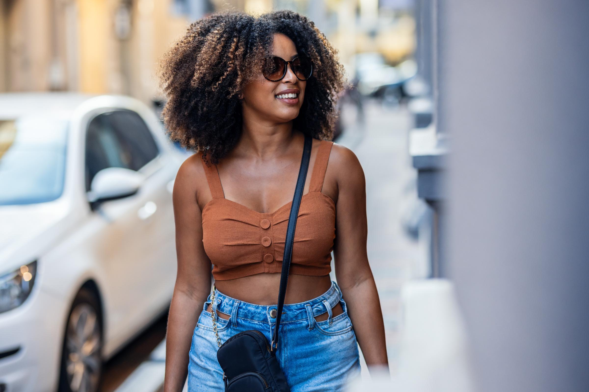 Woman enjoying a walk in the city | Source: Shutterstock