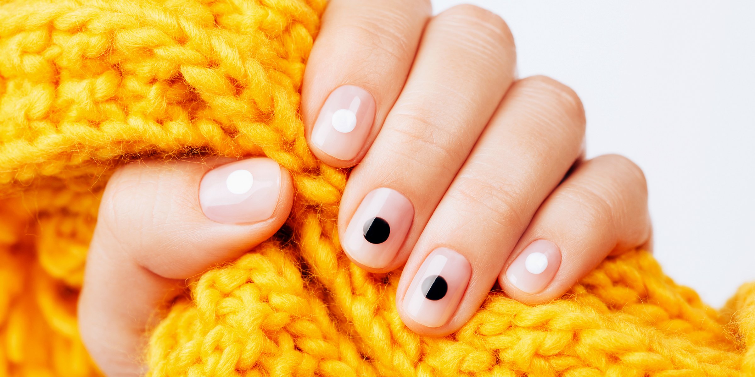 Black and white dotted minimalistic manicure | Source: Shutterstock