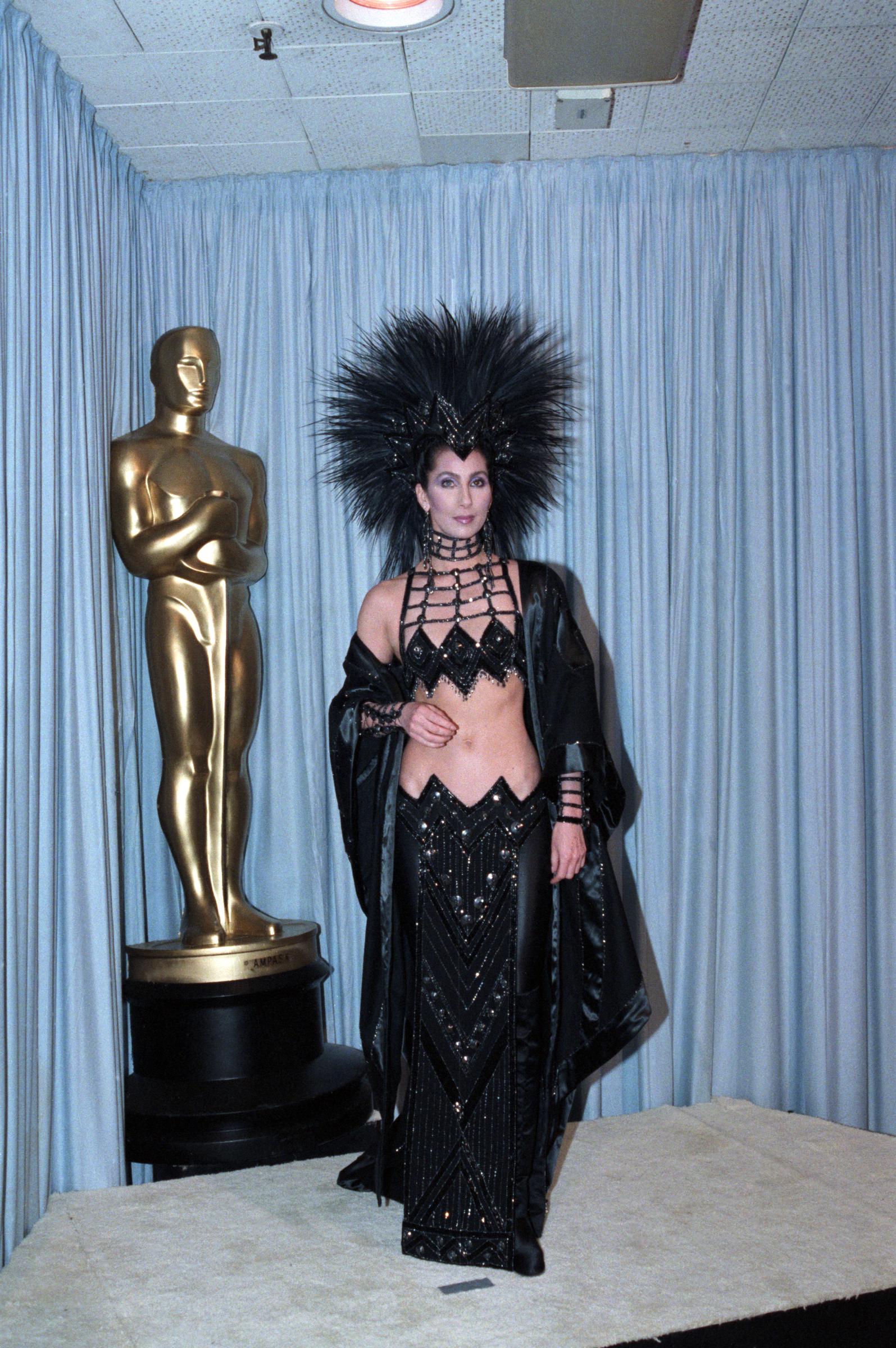 Cher wearing the famous Bob Mackie "revenge" dress at the 1986 Academy Awards | Source: Getty Images