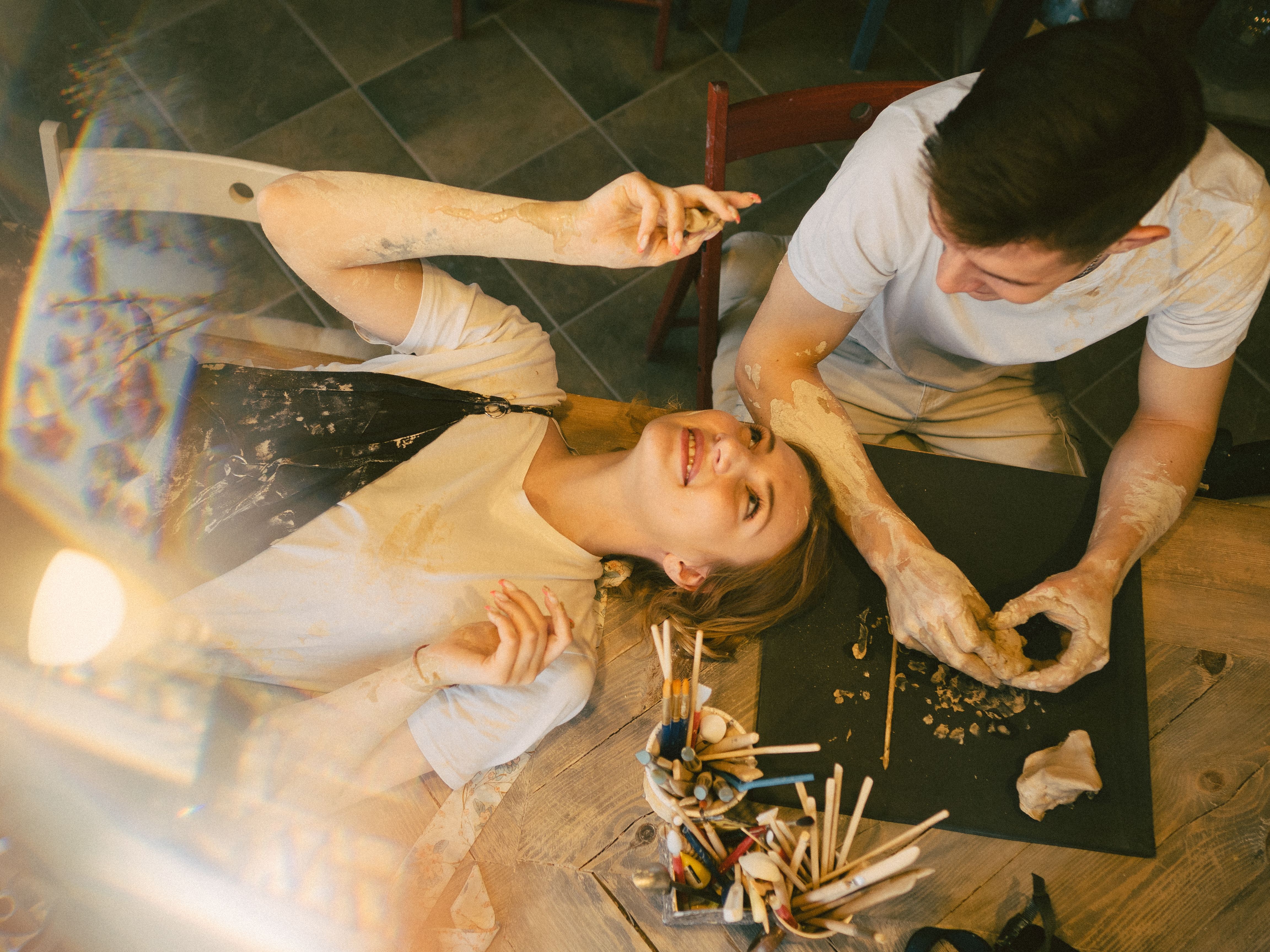 A happy couple enjoying a playful art session together | Source: Pexels