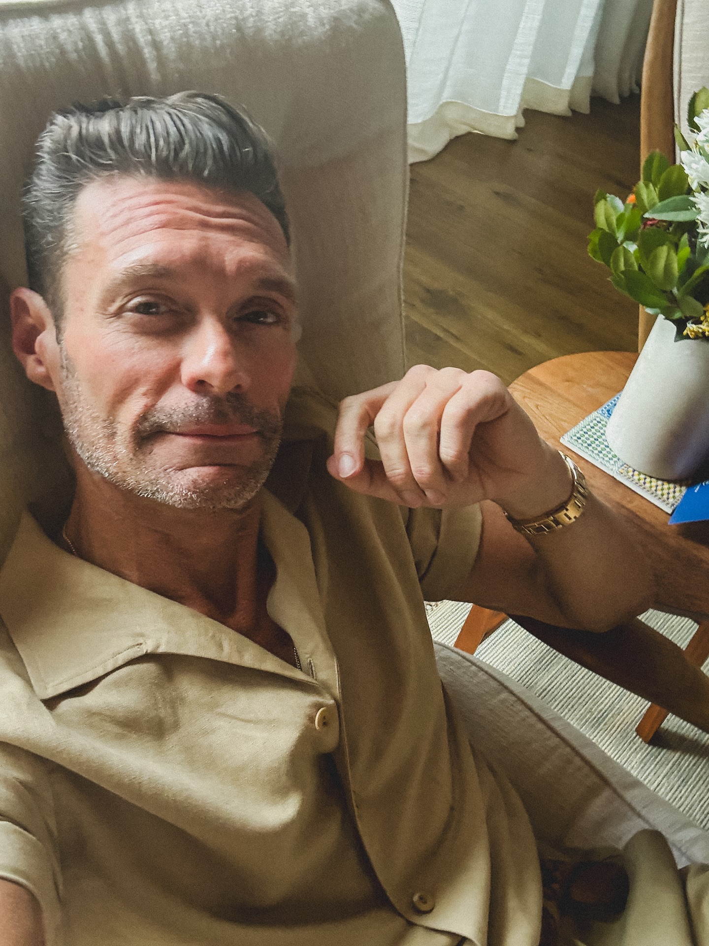Ryan Seacrest lounges indoors in a beige shirt, offering a close-up look, posted on June 30, 2025 | Source: Instagram/ryanseacrest