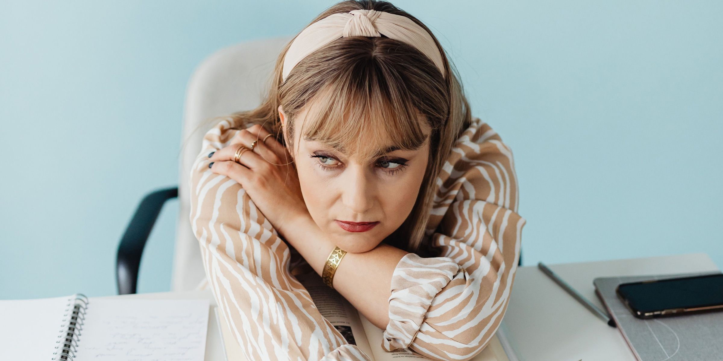 Woman contemplating at work | Source: Pexels