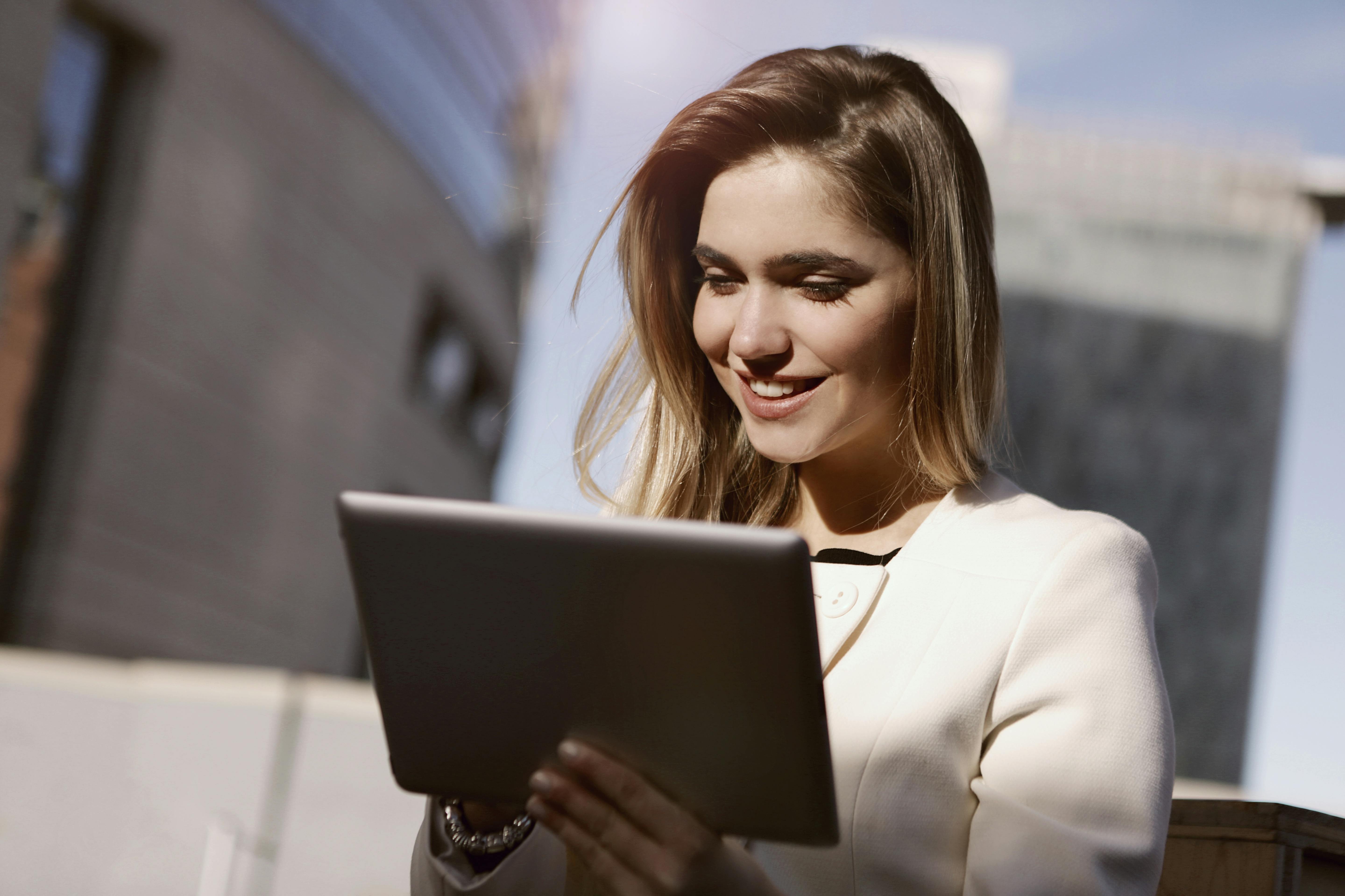 A woman working on her tablet | Source: Pexels