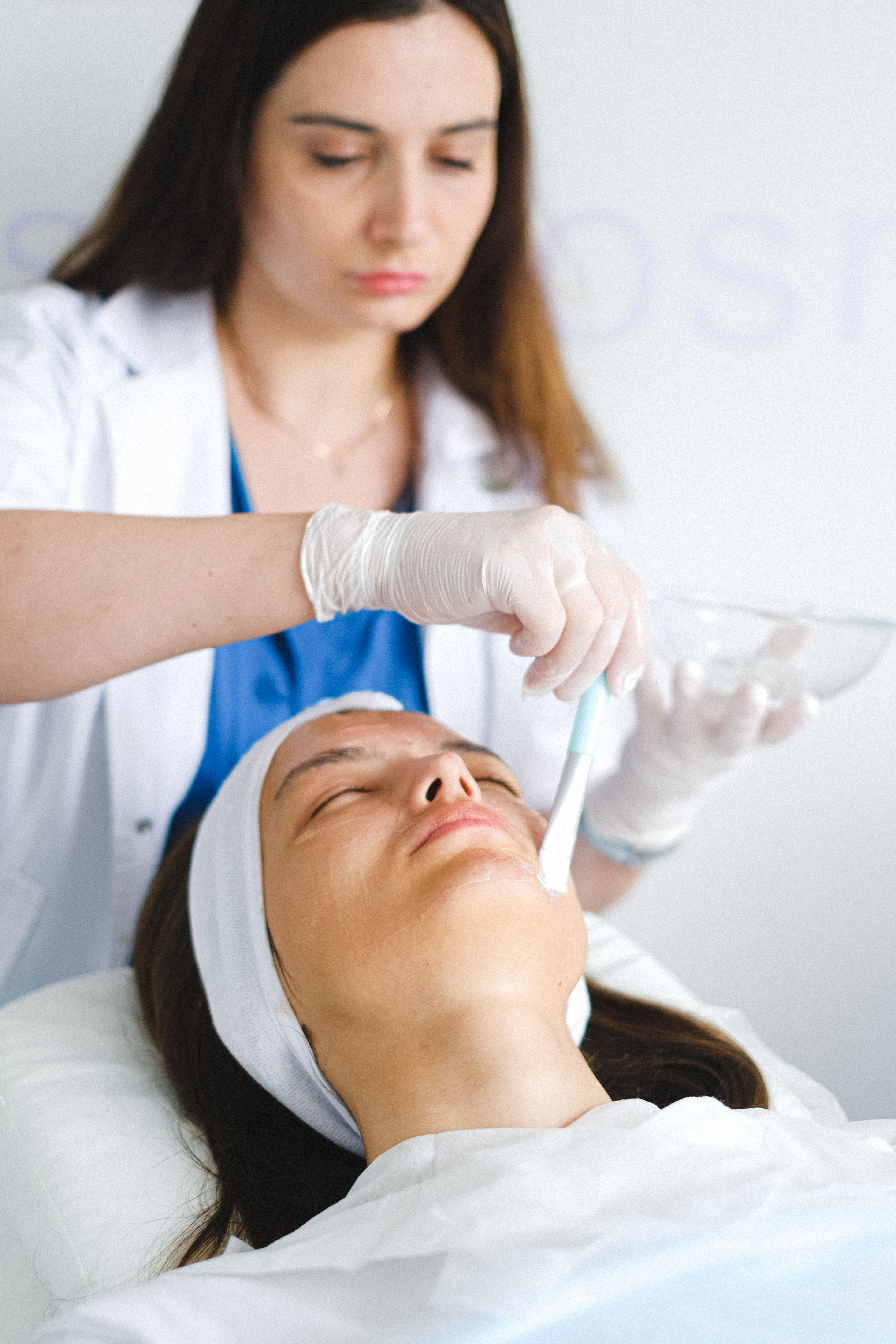 Dermatologist treating a patient | Source: Pexels